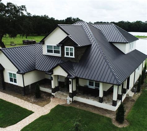 white house black trim metal roof|houses with white metal roofs.